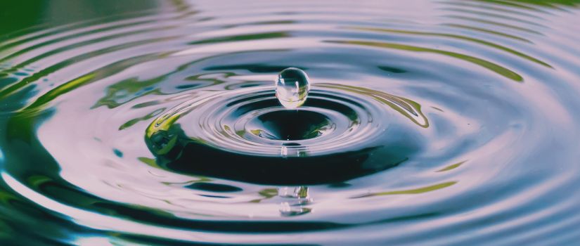 Close-up of water droplet creating ripples